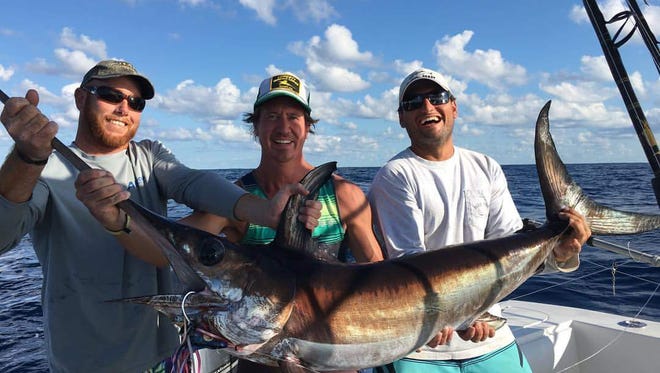 Daytime swordfish are one of the species being caught by bluewater anglers, as these guys did aboard Off the Chain charters out of Sailfish Marina in Stuart.
