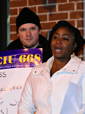 SEIU Local 668 Union Member Christopher Bangs, of Pittsburg, looks on as York NAACP President Sandra Thompson speaks during a rally, in support of more than 500 recently furloughed state employees, outside of Senator Scott Wagner's office in York City, Monday, Dec. 19, 2016. Dawn J. Sagert photo