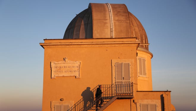 In December 2013, Brother Guy Consolmagno, a native of metro Detroit and one of 12 Vatican astronomers, climbs the steps of one of the two observatories at the Vatican Observatory. Kathy Kieliszewski/Detroit Free Press