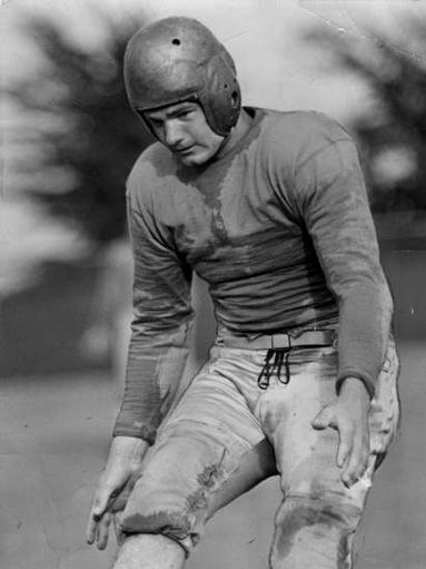 Kinnick practices dropkicking on Nov. 18, 1938.