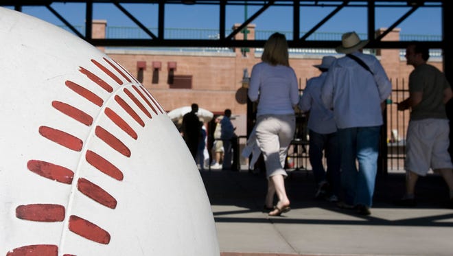 Fans enter Scottsdale Stadium, the spring-training home of the San Francisco Giants.