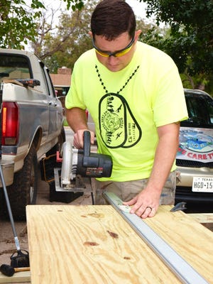 Airman First Class Reese Winters leads his first Dyess We Care Team project.