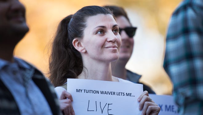 Amanda Williams, a wildlife and fisheries graduate student, attends a rally against the tax reform bill at Clemson University on Wednesday, November 29, 2017.