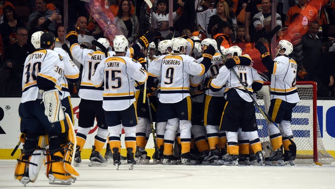 Nashville Predators players celebrate after beating the Anaheim Ducks 2-1 in Game 7 of the first-round series on Aprul 27, 2016.