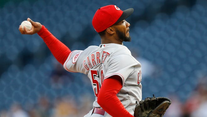 Cincinnati Reds starting pitcher Amir Garrett throws against the Pittsburgh Pirates in the first inning of a baseball game Wednesday, April 12, 2017, in Pittsburgh. (AP Photo/Keith Srakocic)
