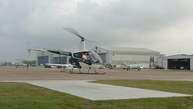 A helicopter lands at Acadiana Regional Airport, which could become the Hurricane Command Center this season.  Advertiser file photo