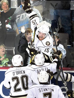 The Hershey Bears' Travis Boyd (15) celebrates after scoring the game-winning goal in overtime during Game 7 of the AHL playoff series against Wilkes-Barre/Scranton on Sunday evening at the Giant Center. Hershey won 3-2.