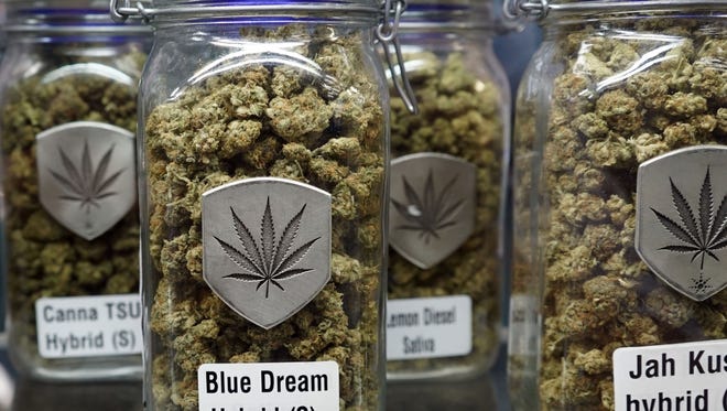Jars of marijuana offered for sale at a Colorado-licensed cannabis dispensary. With tens of thousands of jobs and billions of dollars at stake, the marijuana industry is closely watching the confirmation hearings for attorney general nominee Jeff Sessions.