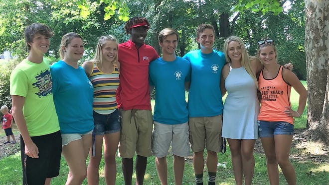 Jordan Washington, fourth from left, was saved from drowning July 26 in the River View Community Pool by his friend Corey Phillips, assistant pool manager Danielle Newman and lifeguards Carolyn Cox, Caleb Fischer, Andrew Martin, Mackenzie Hudson and Lindsey Ashcraft.