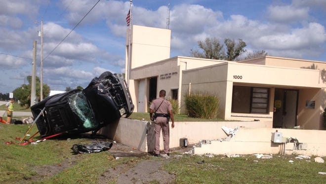 A pickup overturned and damaged a wall at the Lehigh Acres Fire Department station on Joel Boulevard
