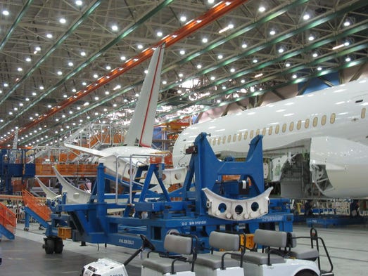 Boeing 787s move through Boeing's assembly line in