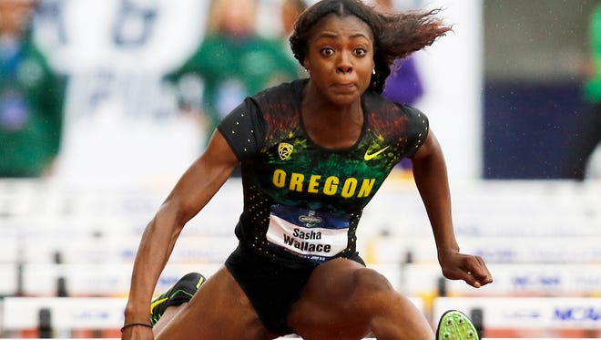 Oregon's Sasha Wallace competes in a women's 100-meter hurdles semifinal at the NCAA outdoor track and field championships in Eugene, Ore., Thursday, June 9, 2016. (AP Photo/Ryan Kang)
