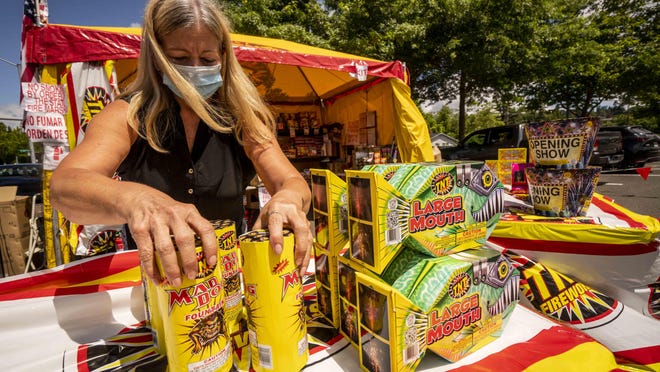 Lawana Mount, operator of TNT Fireworks, organizes one of the three stands that she owns. This stand is located on the corner of Hilyard Street and 30th Avenue in Eugene. As organized firework shows are canceled during the pandemic, more communities might be considering purchasing their own fireworks. [Dana Sparks/The Register-Guard] - registerguard.com