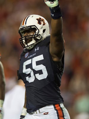Auburn defensive lineman Carl Lawson (55) celebrates after a turnover on downs during the second half of the NCAA college football game between Auburn vs. Alabama, Saturday, Nov. 28, 2015, at Jordan-Hare Stadium in Auburn, Ala. Alabama defeated Auburn 29-13.