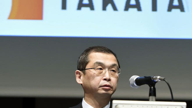 FILE - In this Nov. 4, 2015 file photo, Japanese air bag maker Takata Corp. CEO Shigehisa Takada speaks at a press conference in Tokyo.  Embattled Takata Corp. reported a half-year loss of 5.58 billion yen ($45.8 million) on Friday, Nov. 6, due to recall costs, as Toyota announced it would stop using Takata air bag inflators that are at the center of the company's massive product safety scandal. (Kyodo News via AP, File) JAPAN OUT, MANDATORY CREDIT