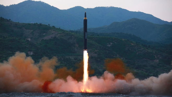 This photo distributed by the North Korean government shows the Hwasong-12, a new type of ballistic missile, at an undisclosed location in North Korea. North Korea on Monday boasted it successfully launched a new type of "medium long-range" ballistic rocket that can carry a heavy nuclear warhead, an escalation of its nuclear program.