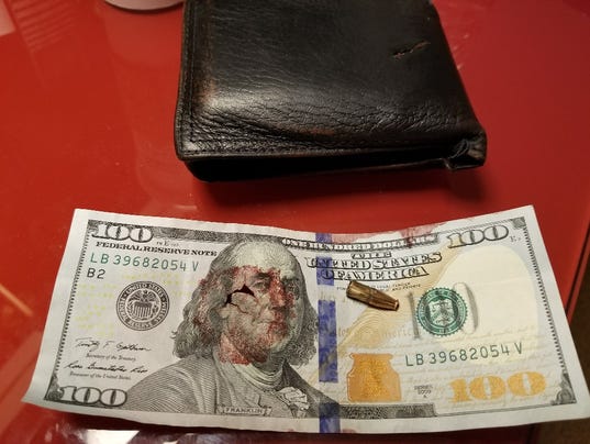 Blood-stained hundred-dollar bill