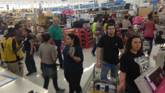 Shoppes find their way through Walmart in Dothan, Ala., on Thursday, Nov. 26, 2015.
