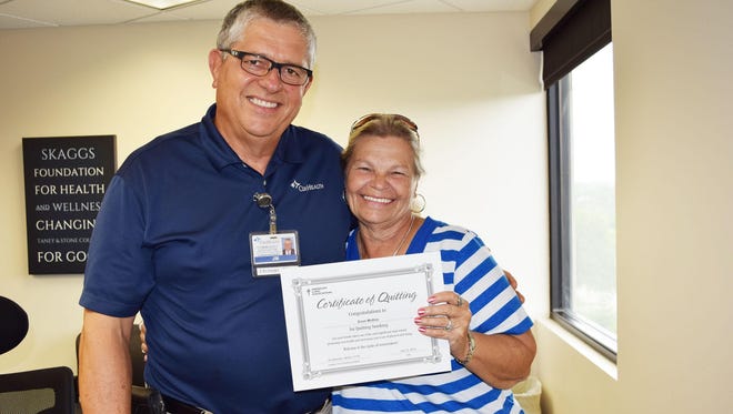 Jim Brawner and Evon McKim. McKim received her “Certificate of Quitting” from Brawner after completing Brawner’s tobacco cessation class and conquering her smoking habit.