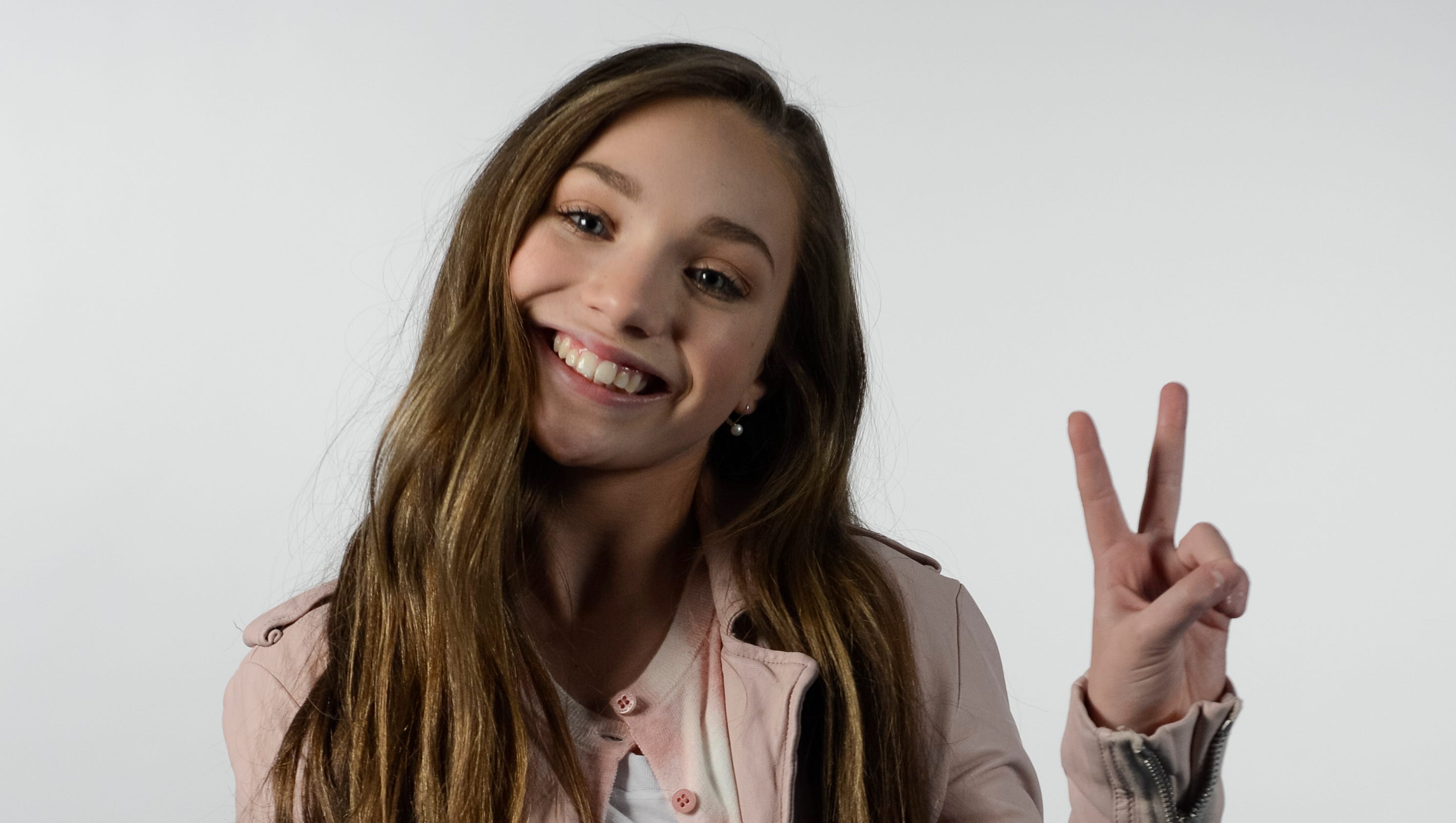 Maddie Ziegler Swinging from Sia's chandelier