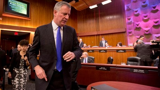 New York City Mayor Bill de Blasio arrives to testify at a joint legislative budget hearing hearing in Albany Tuesday, Jan. 26, 2016,