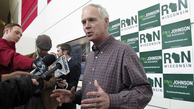 U.S. Sen. Ron Johnson speaks with reporters Friday before the Wisconsin GOP convention in Green Bay.