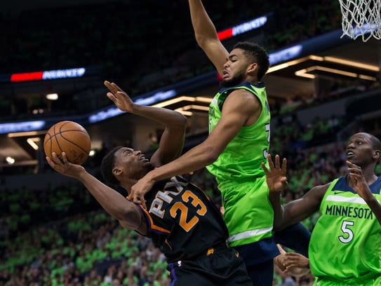 Timberwolves center Karl-Anthony Towns fouls Suns forward