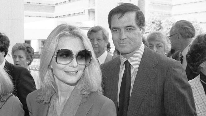 In this May 3, 1981 file photo, John Gavin and his wife Constance arrive for a memorial service for Jules Stein in Los Angeles.