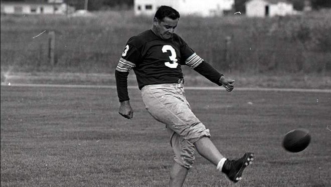 Ben Agajanian kicks during Packers training camp in 1962 at City Stadium in Green Bay.