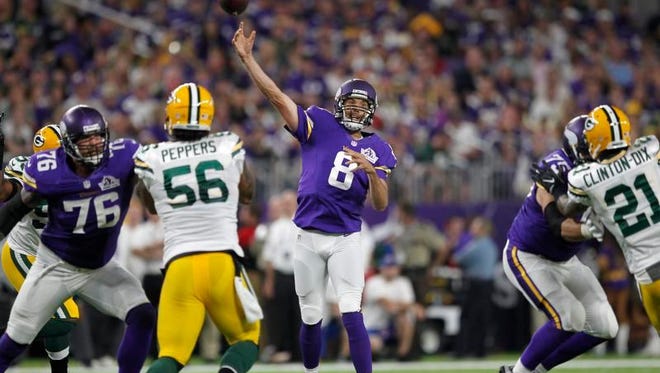 Minnesota Vikings quarterback Sam Bradford (8) throws a pass during the first half of a National Football League football game against the Green Bay Packers on Sunday, Sept. 18, 2016, in Minneapolis.