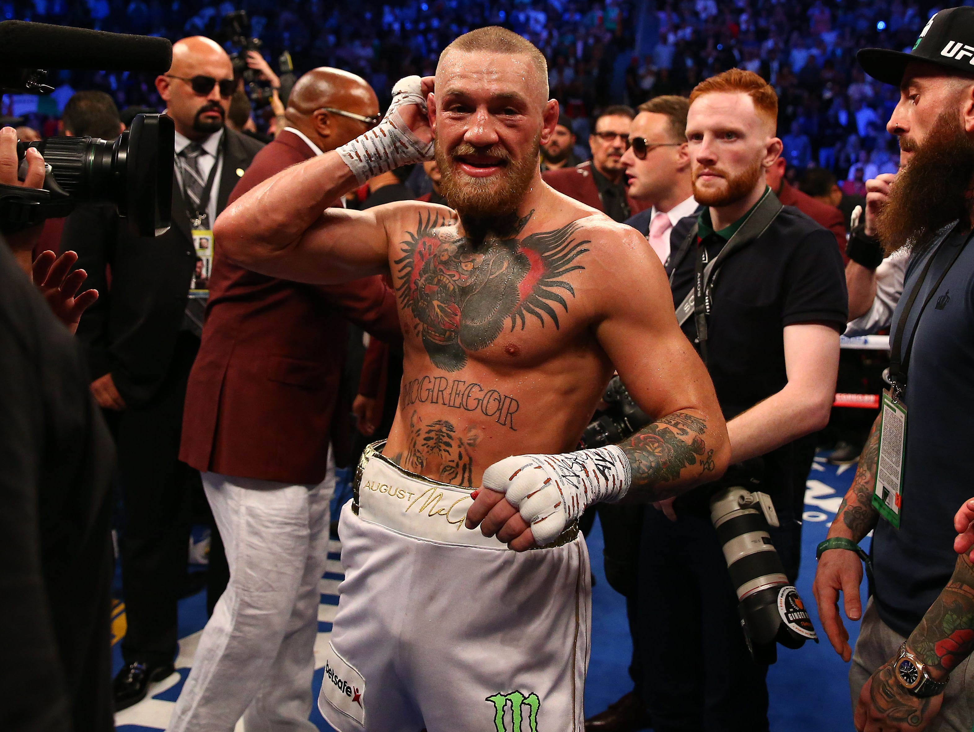 Conor McGregor reacts following his loss in the tenth round by TKO to Floyd Mayweather Jr. at T-Mobile Arena.