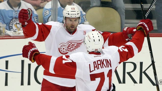 Detroit Red Wings left wing Thomas Vanek and center Dylan Larkin (71) celebrate a goal by Larkin against the Pittsburgh Penguins on Dec. 3, 2016.