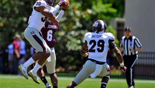 White defensive back Jay Hughes (30) intercepts a pass during the first half of Mississippi State's spring NCAA college football game, Saturday, April 20, 2013, in Starkville, Miss. (AP Photo/Austin McAfee)