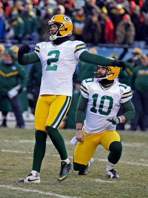 Green Bay Packers kicker Mason Crosby (2) watches his 32-yard field goal go through the uprights to win the game.