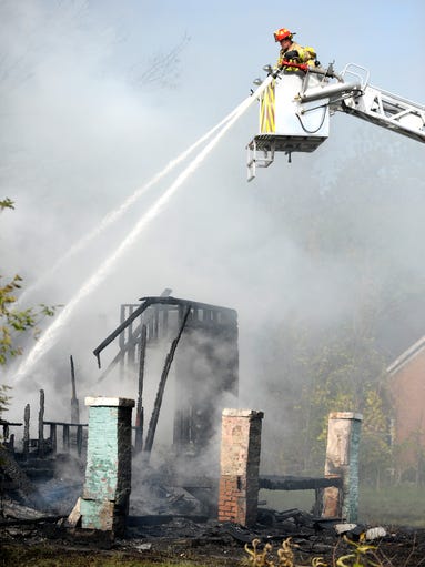 Hamtramck firefighters operate Tower 1 at the Joann