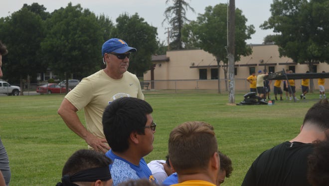 New Exeter football coach Keirsten Lamb observes practice on Wednesday in Exeter.