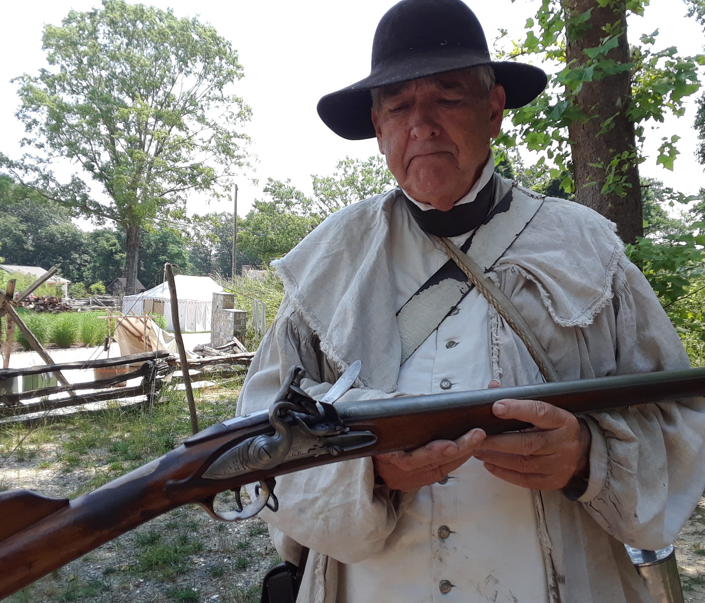 Bittner demonstrates for visitors the step-by-step process of loading and firing a musket. A well-drilled soldier or militiaman could fire three times per minute.
