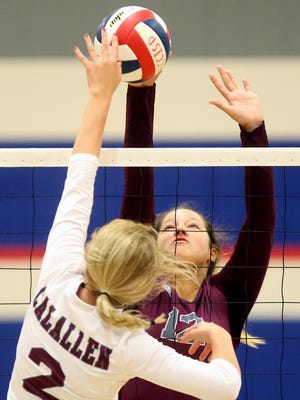 London's Ashley Lyne reaches to block Calallen's Kaycee Brimhall during the CCISD McDonald's SpikeFest on Friday, Aug. 11, 2017, at Veterans Memorial High School in Corpus Christi.