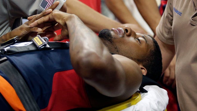 Indiana Pacers' Paul George is taken off the court after he was injured during the USA Basketball Showcase game Friday, Aug. 1, 2014, in Las Vegas.