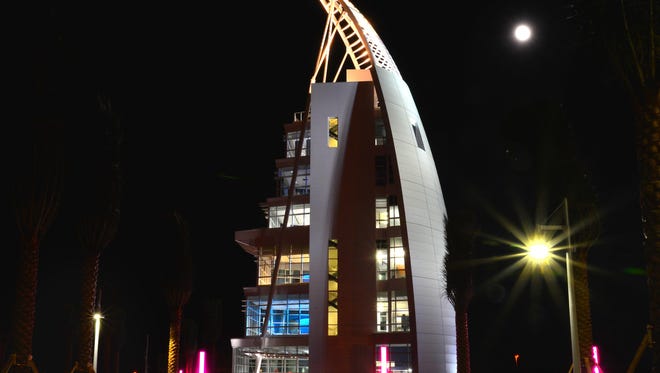 The moon shines above Port Canaveral's Exploration Tower.