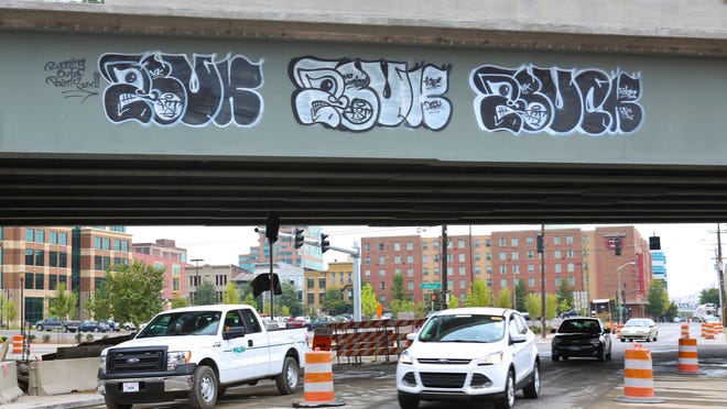 Fresh graffiti on the new I-65 section crossing over S. Preston St. and Jefferson St. in downtown Louisville. Aug. 7, 2014