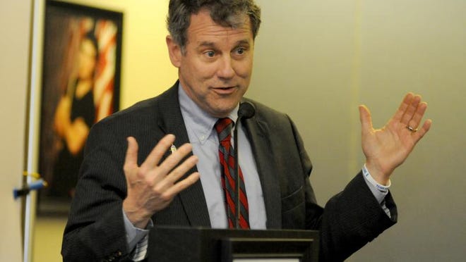 
Senator Sherrod Brown gestures as he talks with employees at Lifetouch Church Directories in Galion.
