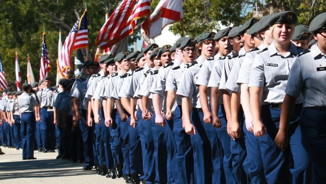 Members of the Island Coast high School JROTC march through downtown Cape Coral during the Veteran's Day Parade on SE 47th Terrace on Tuesday.