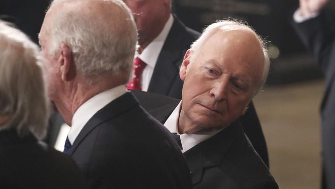 FILE - In this Dec. 3, 2018, file photo, former Vice President Dick Cheney looks behind former Secretary of State James Baker as he stands next to former Vice President Dan Quayle, back, during memorial ceremonies for former President George H.W. Bush at the Capitol in Washington. (Jonathan Ernst/Pool Photo via AP)