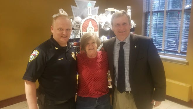 Interim York City Police Chief Troy Bankert with his mother, Donna, and York City Mayor Michael Helfrich following the city council's decision to name him the official city police chief.