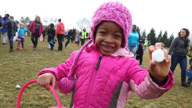 Kayla Waller, 6, of Southfield proudly shows off the marshmallow she ran after Friday during the Great Marshmallow Drop 2015 at Catalpa Oaks County Park in Southfield.