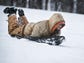 Doug St. Amand of New Castle slides down the hill through