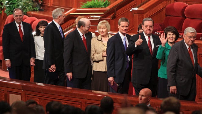 The Quorum of the Twelve Apostles of The Church of Jesus Christ of Latter-day Saints leave the Conference Center in Salt Lake City following a session of the church’s General Conference in October 2011.
