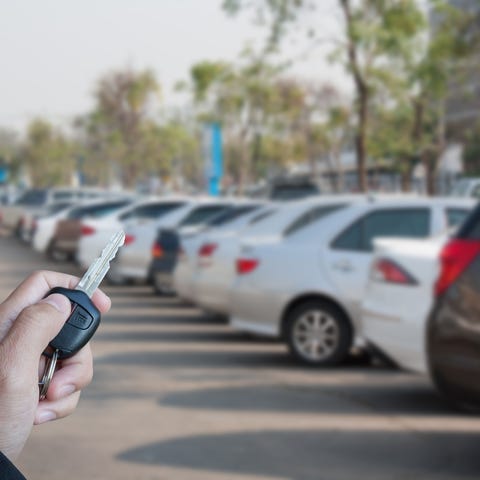 A row of vehicles at a car dealership.