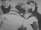 Graduate students Nancy Mortensen and Al Beardsley embrace after a wreath-laying ceremony Nov. 5, 1991, at the University of Iowa. 